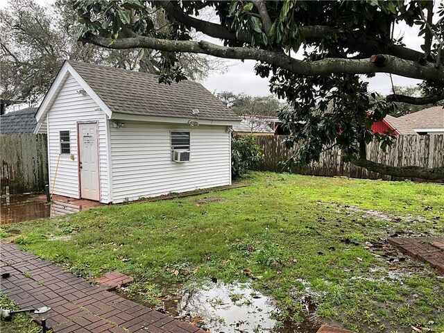 244 Waldo St, Metairie, LA 70003 - view of yard featuring cooling unit, fence private yard, and an outdoor structure