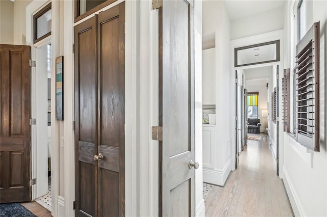 hallway with light wood-type flooring