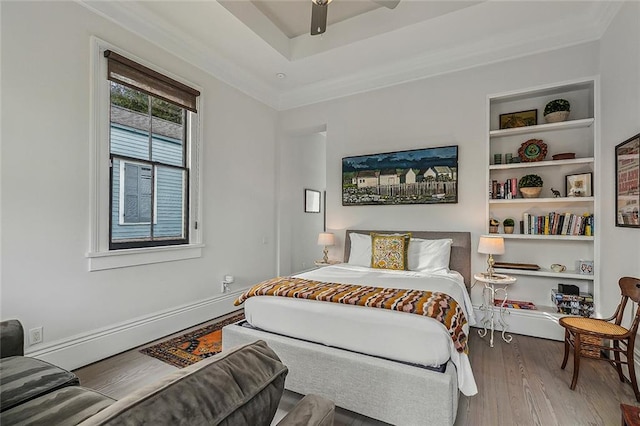 bedroom with ceiling fan and wood finished floors