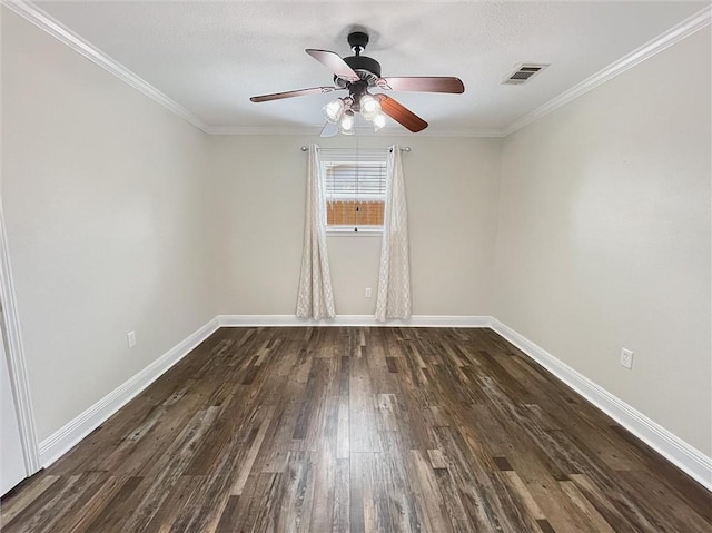 unfurnished room featuring ceiling fan, dark wood-style flooring, visible vents, baseboards, and ornamental molding