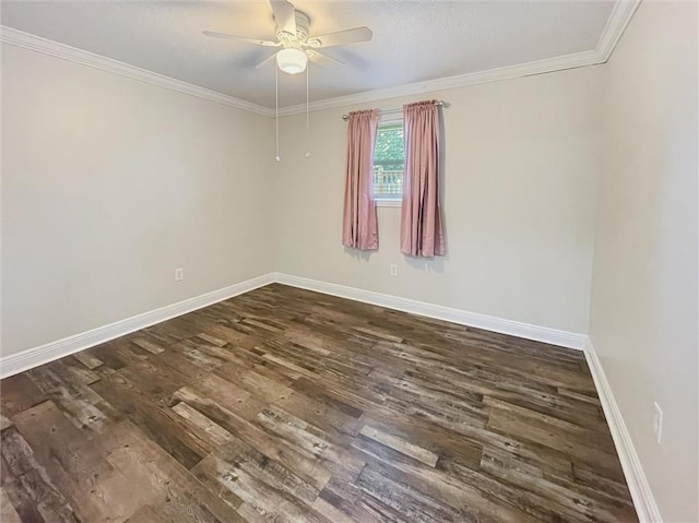 unfurnished room featuring crown molding, dark wood-style flooring, a ceiling fan, and baseboards