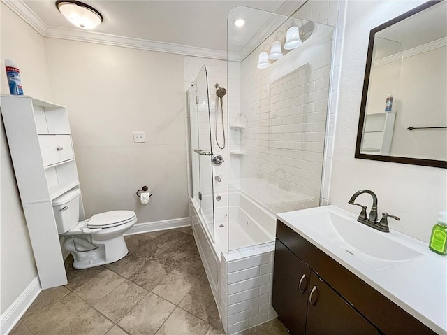 full bath featuring toilet, tiled shower / bath combo, vanity, baseboards, and crown molding