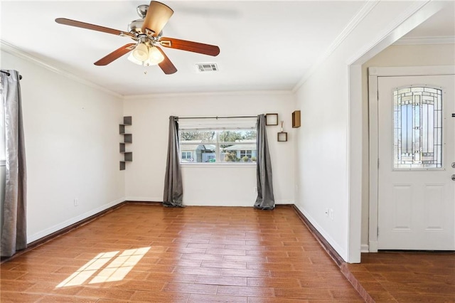 3244 Continental Dr, Kenner, LA 70065 - foyer entrance featuring visible vents, crown molding, baseboards, and wood finished floors