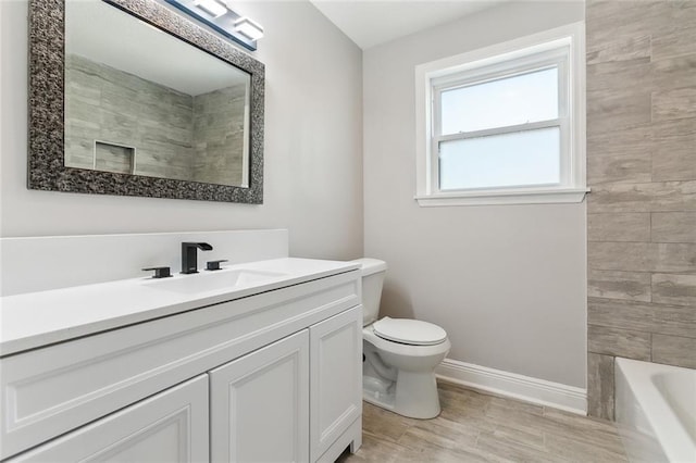 full bathroom featuring toilet, vanity, baseboards, a shower, and a bath