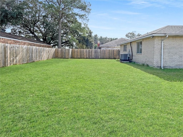 view of yard featuring a fenced backyard and cooling unit