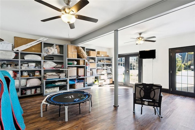 interior space featuring a ceiling fan, french doors, and wood finished floors