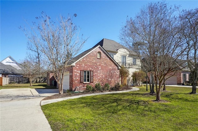 view of front of property with an attached garage, concrete driveway, brick siding, and a front yard