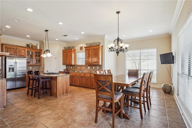 dining area with crown molding, recessed lighting, visible vents, and a notable chandelier