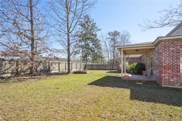 view of yard with a fenced backyard