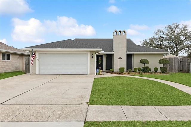 ranch-style home with a chimney, fence, a garage, driveway, and a front lawn