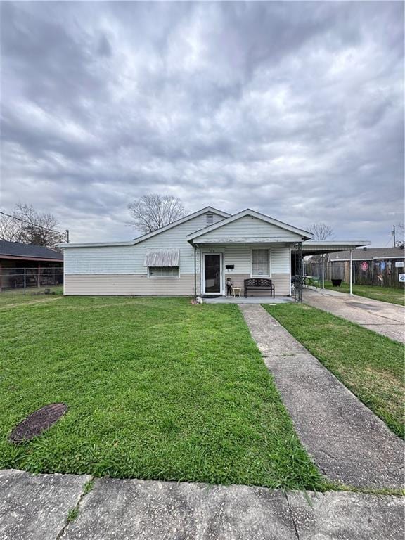 view of front of house featuring a porch, a front lawn, and concrete driveway