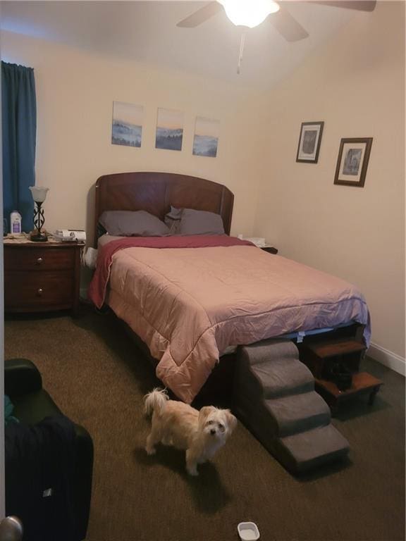 bedroom with ceiling fan, baseboards, vaulted ceiling, and carpet flooring