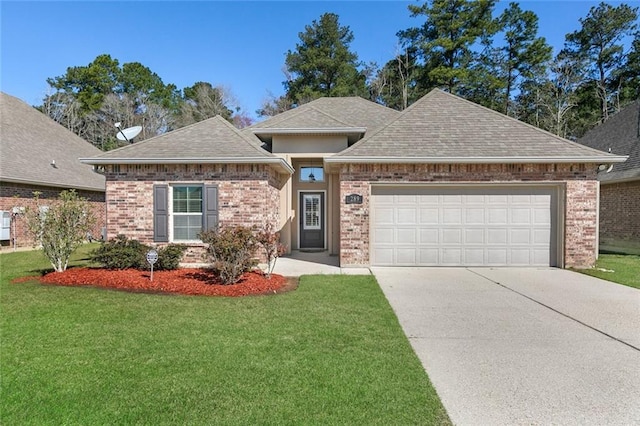 view of front of house with an attached garage, a shingled roof, and a front lawn