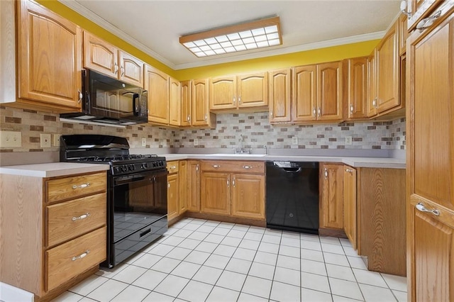 kitchen with tasteful backsplash, light countertops, black appliances, and light tile patterned floors