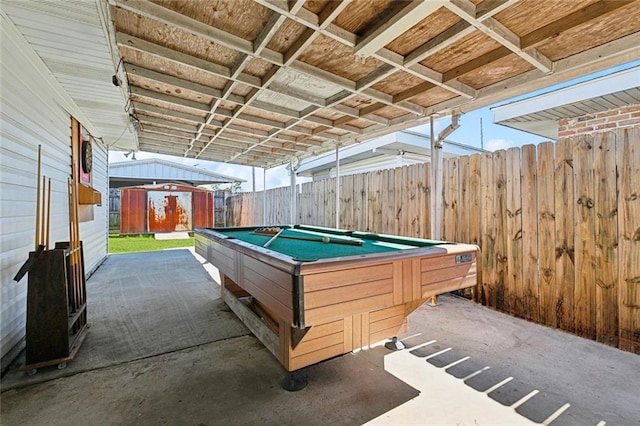 recreation room featuring billiards and wooden walls