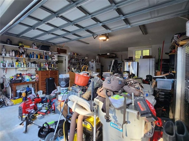 garage with a workshop area and stainless steel fridge with ice dispenser