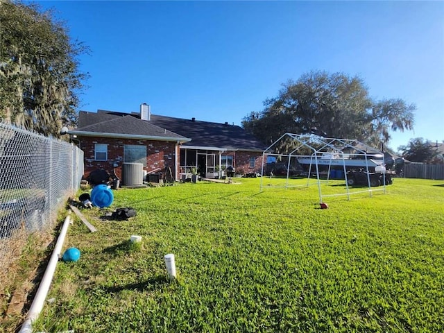 view of yard featuring fence and cooling unit