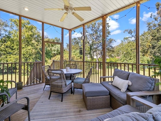 sunroom / solarium with ceiling fan