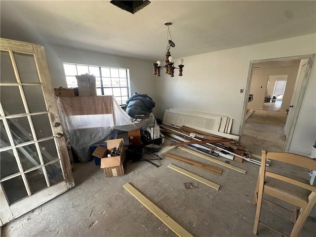 unfurnished dining area with a chandelier