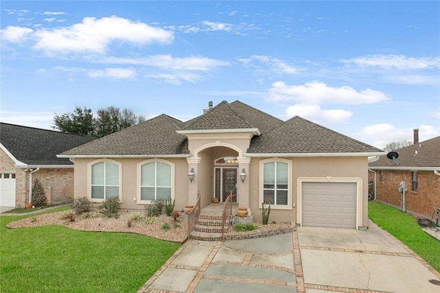 ranch-style home with an attached garage, driveway, roof with shingles, stucco siding, and a front yard