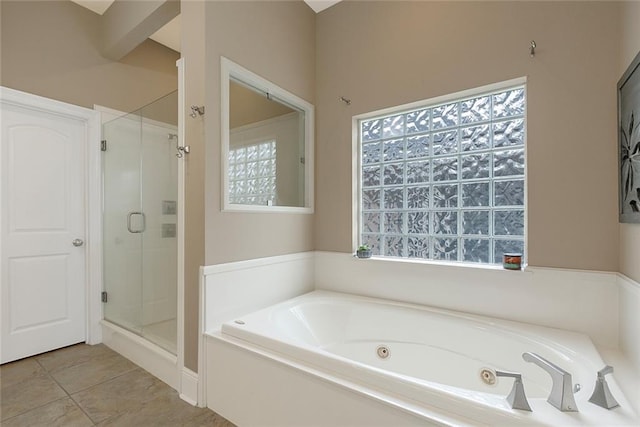 full bathroom featuring a stall shower, tile patterned flooring, and a tub with jets