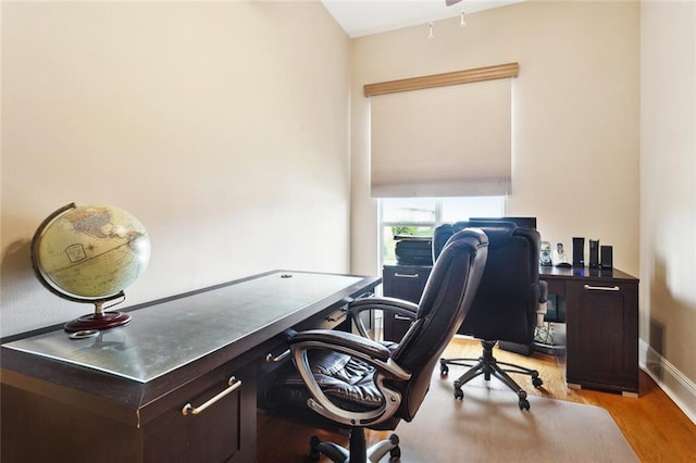 office space featuring light wood-style flooring and baseboards