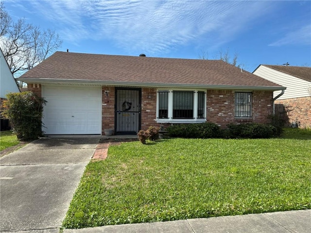 single story home with a garage, brick siding, concrete driveway, and a front yard