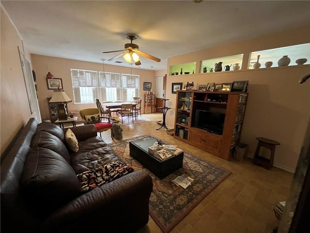 living room featuring a ceiling fan