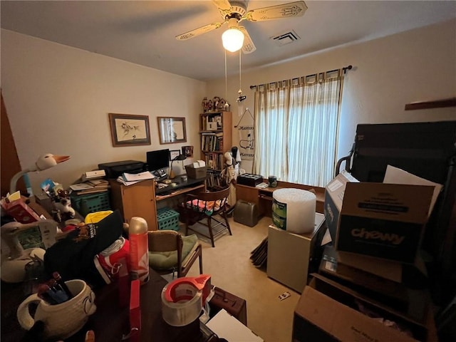 office space with ceiling fan, carpet floors, and visible vents