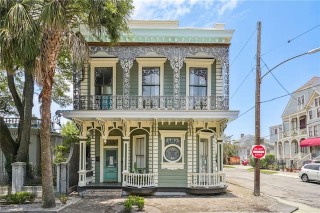 view of front of house with a balcony and a porch