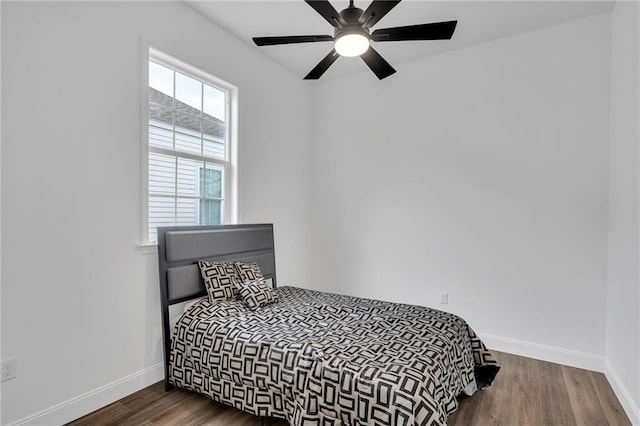 237274 Industry St, New Orleans, LA 70122 - bedroom with dark wood-style floors, ceiling fan, and baseboards