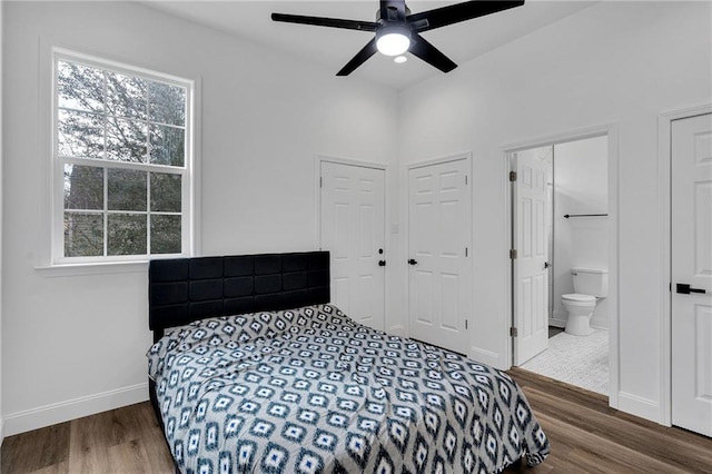 237274 Industry St, New Orleans, LA 70122 - bedroom with multiple windows, wood finished floors, and baseboards