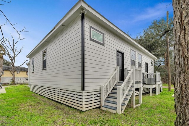 237274 Industry St, New Orleans, LA 70122 - view of property exterior featuring a yard