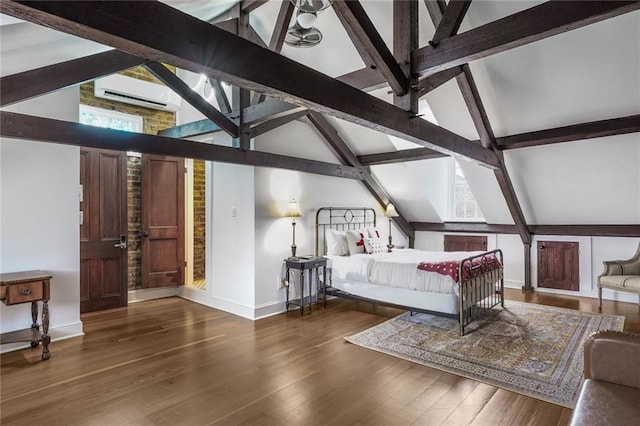 bedroom featuring lofted ceiling with beams, baseboards, wood finished floors, and a wall mounted air conditioner