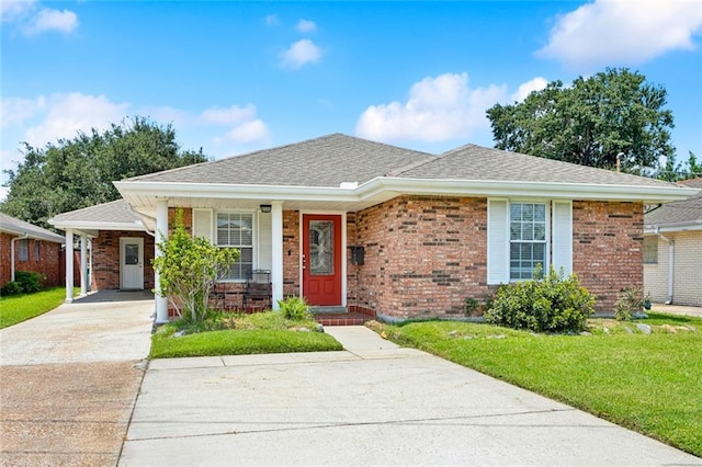 4929 Kawanee Ave, Metairie, LA 70006 - view of front of home with a front lawn, driveway, covered porch, and brick siding