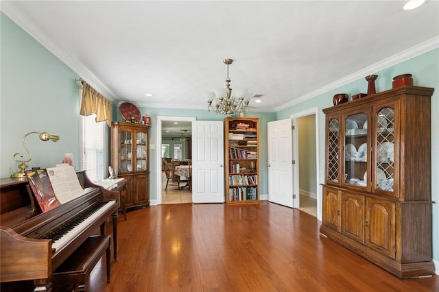 4929 Kawanee Ave, Metairie, LA 70006 - living area with a chandelier, ornamental molding, wood finished floors, recessed lighting, and baseboards