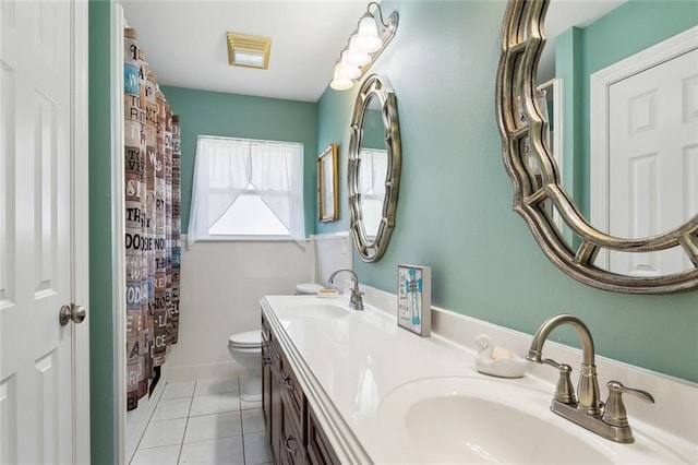 4929 Kawanee Ave, Metairie, LA 70006 - full bathroom featuring toilet, double vanity, and tile patterned floors