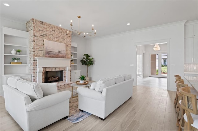 4221 Cypress Point Dr, Covington, LA 70433 - living room featuring crown molding, a brick fireplace, built in features, recessed lighting, and light wood-type flooring