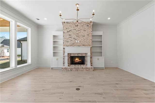 4221 Cypress Point Dr, Covington, LA 70433 - unfurnished living room featuring a healthy amount of sunlight, baseboards, crown molding, and light wood-type flooring