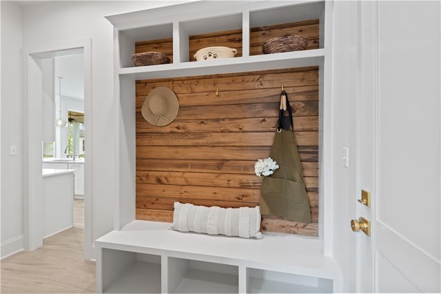 4221 Cypress Point Dr, Covington, LA 70433 - mudroom featuring a sink, baseboards, and light wood-style floors