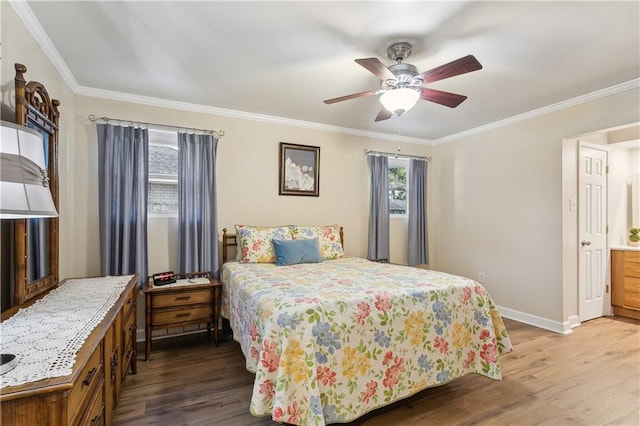 bedroom featuring ornamental molding, a ceiling fan, baseboards, and wood finished floors