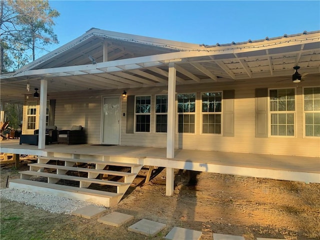 exterior space with an outdoor living space and a wooden deck