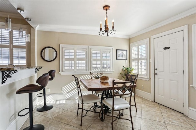 dining room with baseboards, ornamental molding, a chandelier, and light tile patterned flooring