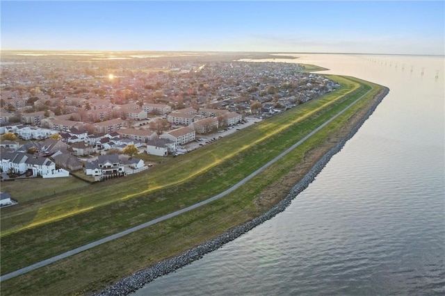 aerial view featuring a water view, a residential view, and a view of the beach