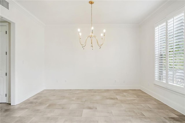 empty room featuring a healthy amount of sunlight, an inviting chandelier, and ornamental molding