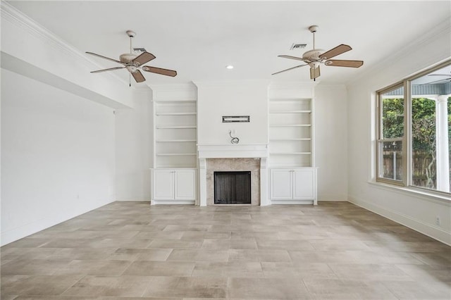 unfurnished living room featuring ceiling fan, a fireplace, and ornamental molding