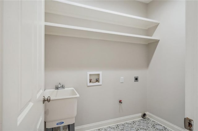 laundry room featuring laundry area, baseboards, hookup for an electric dryer, washer hookup, and a sink