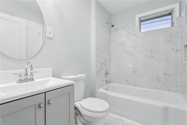 bathroom featuring toilet, vanity, and shower / bathtub combination