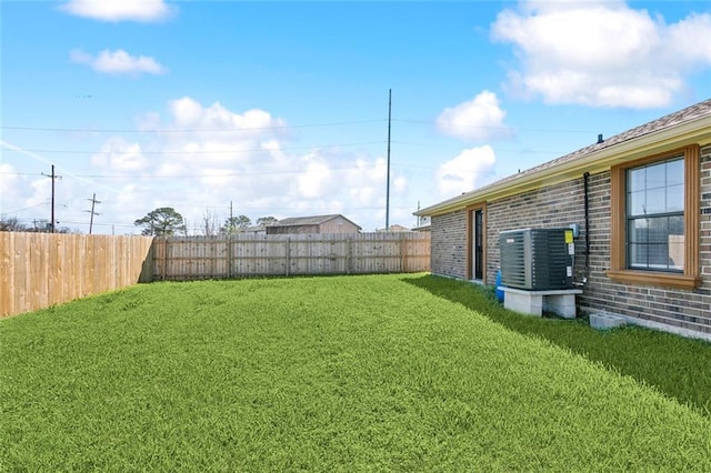 view of yard featuring cooling unit and a fenced backyard