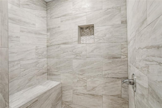 full bathroom with tiled shower